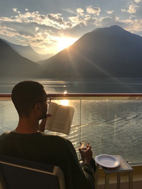 Fred Diarra reads by the water